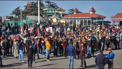 People wait for Himachal Pradesh Assembly election results at Ridge in Shimla on Thursday. (PTI) People wait for Himachal Pradesh Assembly election results at Ridge in Shimla on Thursday. (PTI)