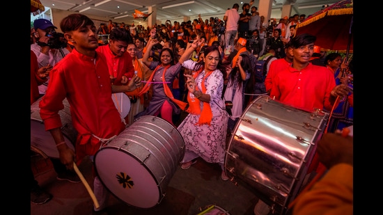 Bharatiya Janata party (BJP) supporters celebrate early leads for the party as vote counting of Gujarat state elections is underway in Gandhinagar. (AP)