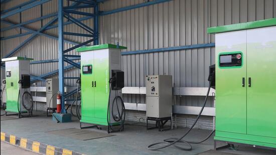 In the absence of a public charging facility, users of electric vehicles are forced to either charge their vehicles at home or at a private charging station, where the prices are more expensive. (Sanjeev Sharma/HT)