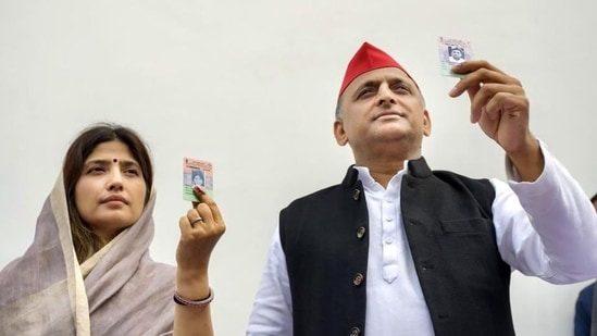 Samajwadi Party president Akhilesh Yadav and his wife and party candidate Dimple Yadav after casting their vote for the Mainpuri Lok Sabha bypolls, at Saifai in Etawah district on Monday. (PTI PHOTO) Samajwadi Party president Akhilesh Yadav and his wife and party candidate Dimple Yadav after casting their vote for the Mainpuri Lok Sabha bypolls, at Saifai in Etawah district on Monday. (PTI PHOTO)