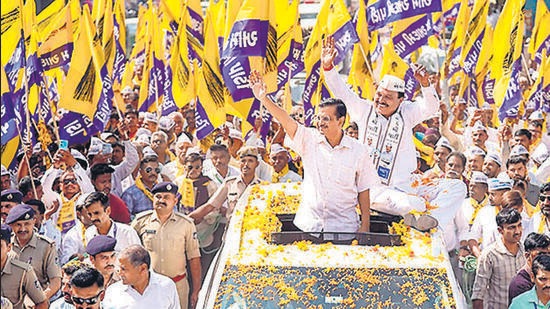 AAP convener Arvind Kejriwal during a roadshow in Gujarat’s Rajkot. (PTI)