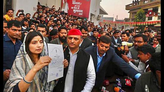 Samajwadi Party candidate Dimple Yadav with her husband and party president Akhilesh Yadav shows the ‘certificate of election’ during a press conference after her victory in Mainpuri by-elections, in Mainpuri, Thursday. (PTI Photo) Samajwadi Party candidate Dimple Yadav with her husband and party president Akhilesh Yadav shows the ‘certificate of election’ during a press conference after her victory in Mainpuri by-elections, in Mainpuri, Thursday. (PTI Photo)