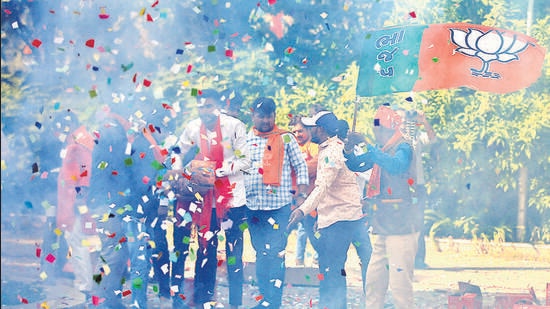 BJP supporters burn firecrackers to celebrate the party’s win in Gandhinagar on Thursday. (Reuters)