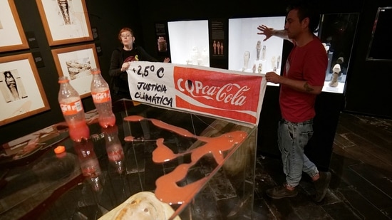 Climate activists of 'Futuro Vegetal' pose after throwing syrup and beetroot juice to resemble petrol and blood at the Egyptian Museum in Barcelona, Spain on November 13.(Futuro Vegetal / REUTERS )