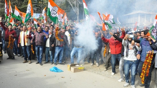 Congress supporters burn firecrackers during a rally to celebrate the party candidate Sundar Singh's victory in the Himachal Pradesh Assembly elections in Kullu.(ANI)