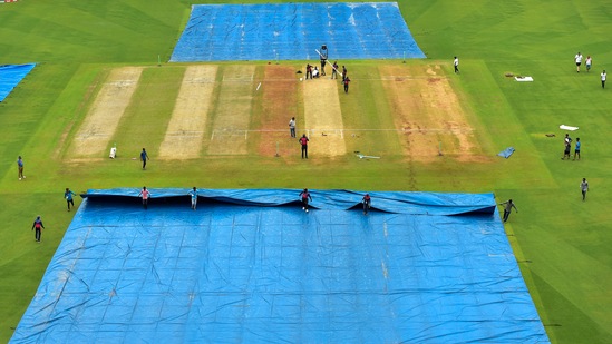 Ground staff remove tarpaulin sheet from the field | Image for representation (PTI)