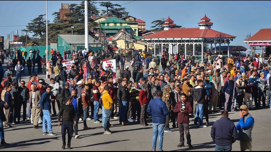 People wait for Himachal Pradesh Assembly?election results at Ridge in Shimla on Thursday. (PTI)