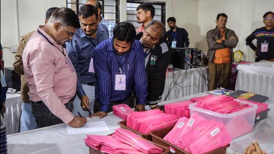 Poll officials at a counting centre in Gujarat on Thursday. (PTI Photo)