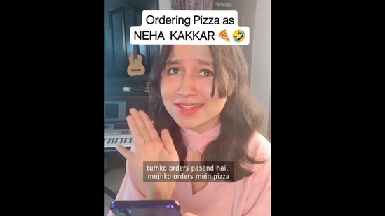 Woman who disguised herself as Neha Kakkar and sang her songs with a twist to place an order for a pizza with extra cheese. (Instagram/@thepranjli) Woman who disguised herself as Neha Kakkar and sang her songs with a twist to place an order for a pizza with extra cheese. (Instagram/@thepranjli)