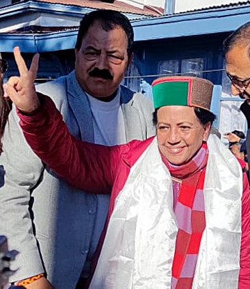 Himachal Pradesh Congress chief Pratibha Singh shows a victory sign while speaking to the media. (ANI)