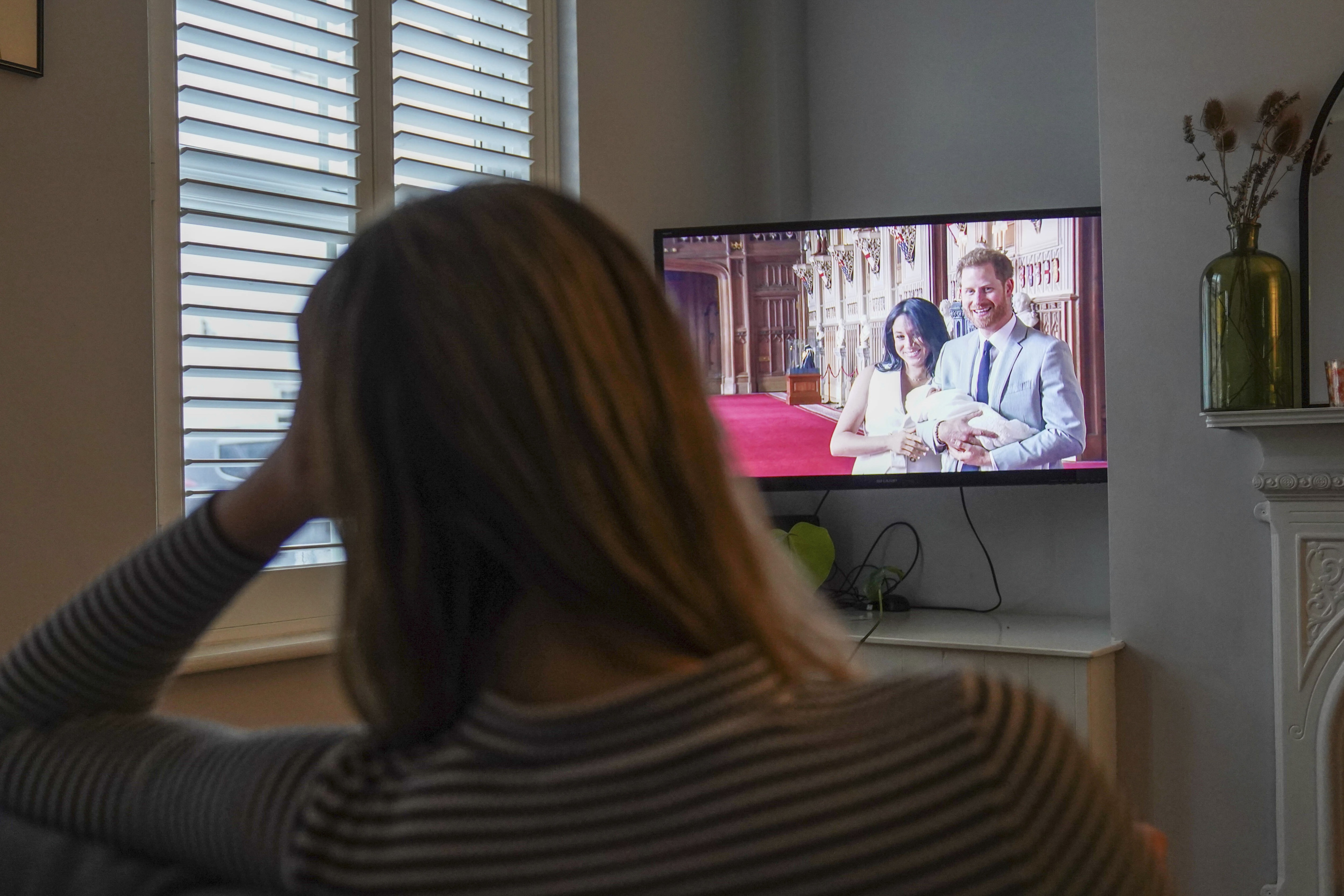 People watch the Duke and Duchess of Sussex's controversial documentary. (AP)
