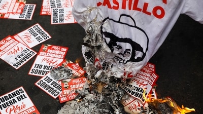 A T-shirt with Castillo's name and posters that say "Cubans out of Peru" are seen scattered during a protest on December 7, in Lima, According to AFP, Castillo's 17-month rule was overshadowed by multiple cabinet reshuffles, six investigations against him and his family, mass protests demanding his removal, and a power struggle with the opposition-backed Congress. The current crisis began as the former rural school teacher faced his third impeachment attempt since unexpectedly wresting power from Peru's traditional political elite. (Alessandro Cinque / REUTERS) A T-shirt with Castillo's name and posters that say "Cubans out of Peru" are seen scattered during a protest on December 7, in Lima, According to AFP, Castillo's 17-month rule was overshadowed by multiple cabinet reshuffles, six investigations against him and his family, mass protests demanding his removal, and a power struggle with the opposition-backed Congress. The current crisis began as the former rural school teacher faced his third impeachment attempt since unexpectedly wresting power from Peru's traditional political elite. (Alessandro Cinque / REUTERS)