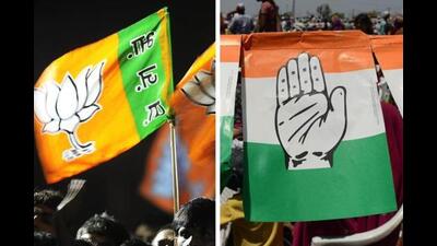A combo picture of BJP and Congress party flags. A combo picture of BJP and Congress party flags.