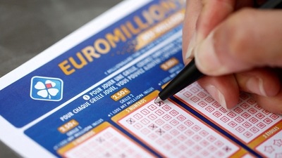 EuroMillions Lottery: A woman fills out a grid of a lottery ticket for EuroMillions. (Reuters)