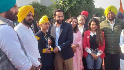 Cabinet minister Gurmeet Singh Meet Hayer felicitating a student at Planet E School, Samrala, in Ludhiana. He said the state government was giving topmost priority to promote sports among the youth in Punjab. (HT PHOTO)