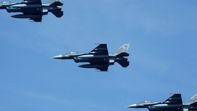 Mitsubishi F-2 fighters of Japan Air Self-Defense Force fly during an International Fleet Review. (Reuters)