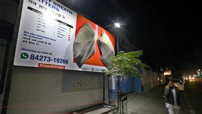 The lungs billboard outside the BCM Arya Model Senior Secondary School, Shastri Nagar, turned black in nine days showcasing the high levels of air pollution in Ludhiana on Friday. (Gurpreet Singh/HT)