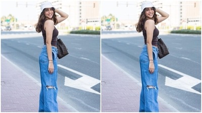 In the end, Sharvari chose a Louis Vuitton bag, chunky white sneakers, a matching bucket hat, and gold earrings for the accessories. Open tresses, nude lip shade, blushed cheeks and minimal makeup completed the glam picks. (Instagram) In the end, Sharvari chose a Louis Vuitton bag, chunky white sneakers, a matching bucket hat, and gold earrings for the accessories. Open tresses, nude lip shade, blushed cheeks and minimal makeup completed the glam picks. (Instagram)