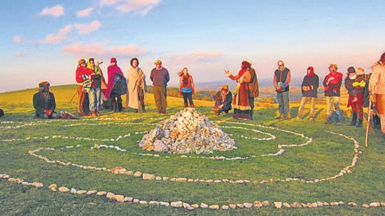 A gathering at the Life Cairn built atop Mt Caburn to commemorate species driven to extinction by human activity. (Courtesy The Life Cairn)