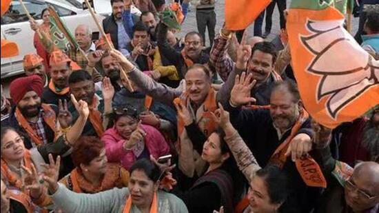 BJP supporters celebrating victory in Gujarat. (Photo by Ravi Kumar / Hindustan Times)