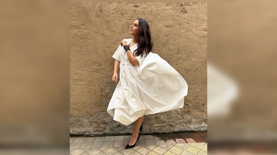 Neha Dhupia's outfit features v-neckline, loose elbow-length sleeves and an asymmetrical hemline.(Instagram/@nehadhupia)