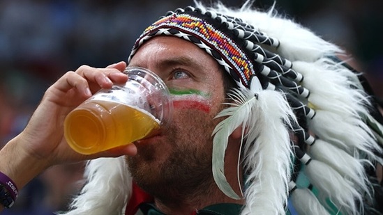 A Mexico fan enjoys beer during the Argentina game (Getty)