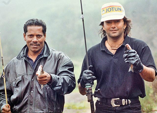 On a fishing break with make-up man Alok Dutta when the Ooty weather didn’t permit filming of Kali Topi Laal Roomal On a fishing break with make-up man Alok Dutta when the Ooty weather didn’t permit filming of Kali Topi Laal Roomal
