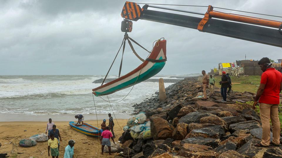 Chennai: A fishing boat being shifted to a safer place at the sea-shore ahead of the landfall of cyclone Mandous (PTI) Chennai: A fishing boat being shifted to a safer place at the sea-shore ahead of the landfall of cyclone Mandous (PTI)