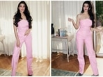 Jacqueline Fernandez recently reached the sets of the Kapil Sharma Show with Ranveer Singh to promote their upcoming film Cirkus. She graced the show wearing a pink strapless latex jumpsuit.(Instagram/@jacquelinef143)