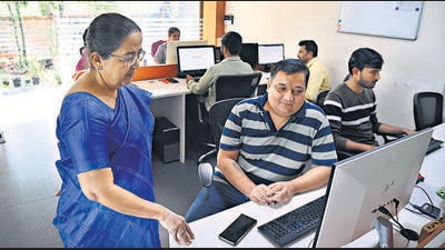 Annada Ranade , founder of HR Neet, with the staff at their office in Pashan. (HT PHOTO)