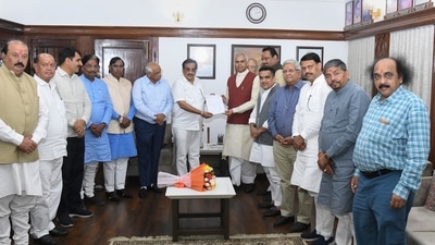 Bhupendra Patel and state BJP president CR Patil presented the letter of government formation to Governor Acharya Devvrat at Raj Bhawan on Saturday. (PTI) Bhupendra Patel and state BJP president CR Patil presented the letter of government formation to Governor Acharya Devvrat at Raj Bhawan on Saturday. (PTI)