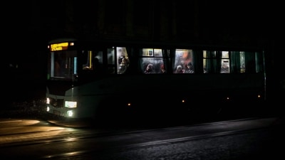 Passengers ride in a city bus down a street during a power cut in downtown Odessa, amid the Russian invasion of Ukraine. (AFP) Passengers ride in a city bus down a street during a power cut in downtown Odessa, amid the Russian invasion of Ukraine. (AFP)