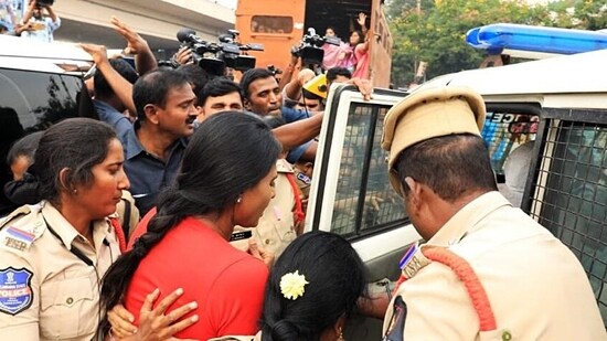 Women Police personnel take away YSR Telangana Party chief YS Sharmila while she was staging a dharna after her permission was denied by the Warangal Police for her Padayatra, near BR Ambedkar statue, in Hyderabad on Friday. (ANI Photo)