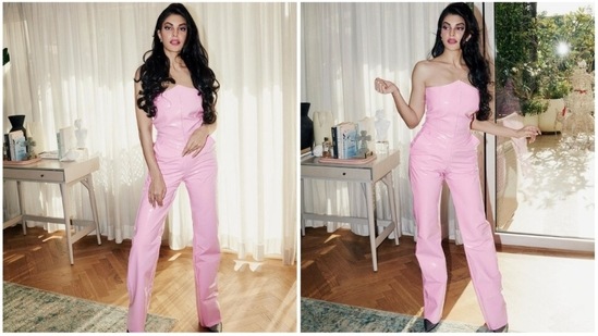 Jacqueline Fernandez recently reached the sets of the Kapil Sharma Show with Ranveer Singh to promote their upcoming film Cirkus. She graced the show wearing a pink strapless latex jumpsuit.(Instagram/@jacquelinef143)