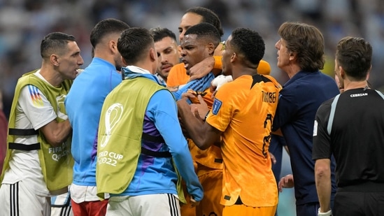 Netherlands' defender Denzel Dumfries (C) is calmed down by teammates during the Qatar 2022 World Cup quarter-final football match between The Netherlands and Argentina at Lusail Stadium, north of Doha on December 9, 2022. (Photo by JUAN MABROMATA / AFP)(AFP)