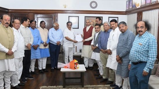 Bhupendra Patel and state BJP president CR Patil presented the letter of government formation to Governor Acharya Devvrat at Raj Bhawan on Saturday. (PTI)
