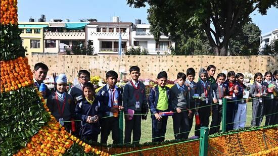 School students admiring a boat topiary at the Chrysanthemum Show at Terraced Garden in Sector 33, Chandigarh. (Keshav Singh/HT)