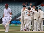 Australian players celebrate the wicket of the West Indies' Joshua de Silva, left, on the fourth day of their cricket test match in Adelaide, Sunday, Nov. 11, 2022. Australian players celebrate the wicket of the West Indies' Joshua de Silva, left, on the fourth day of their cricket test match in Adelaide, Sunday, Nov. 11, 2022.