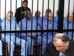 Abu Agila Mohammad Mas'ud Kheir Al-Marimi, also known as Mohammed Abouajela Masud, (2nd L) sits behind bars during a hearing at a courtroom in Tripoli November 16, 2014. 