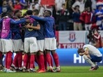 Harry Kane reacts as France players celebrate their victory over England at FIFA World Cup 2022 quarterfinal(AP) Harry Kane reacts as France players celebrate their victory over England at FIFA World Cup 2022 quarterfinal(AP)