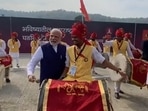 PM Modi playing 'dhol' in Nagpur. PM Modi playing 'dhol' in Nagpur.