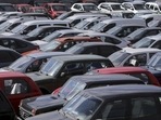 Vehicles, including Lada cars produced by the Russian automobile maker Avtovaz, are parked in Moscow. (File Photo) (REUTERS)