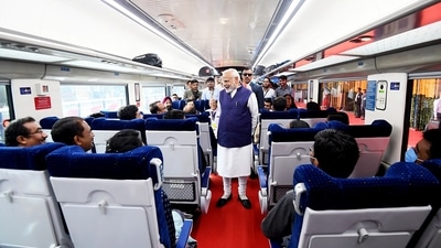 PM Modi purchased a ticket to take a ride on the Metro from Freedom Park to Khapri along with students. (ANI/PIB) PM Modi purchased a ticket to take a ride on the Metro from Freedom Park to Khapri along with students. (ANI/PIB)
