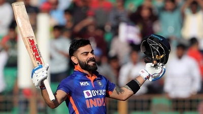 India's Virat Kohli raises his bat and helmet to celebrate scoring a century (AP) India's Virat Kohli raises his bat and helmet to celebrate scoring a century (AP)