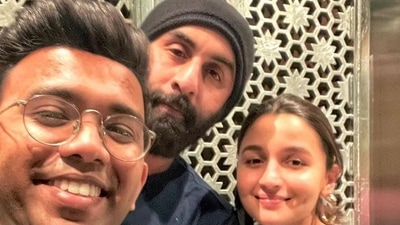Alia Bhatt and Ranbir Kapoor with their fan. Alia Bhatt and Ranbir Kapoor with their fan.