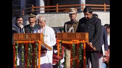 Governor Rajendra Vishvanath Arlekar administers the oath of office to Mukesh Agnihotri on The Ridge in Shimla on Sunday. (Deepak Sansta/HT) Governor Rajendra Vishvanath Arlekar administers the oath of office to Mukesh Agnihotri on The Ridge in Shimla on Sunday. (Deepak Sansta/HT)