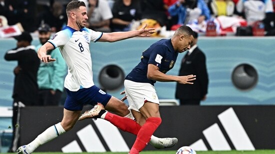 England midfielder Jordan Henderson challenges France forward Kylian Mbappe during the FIFA World Cup 2022 quarter-final match(AFP)