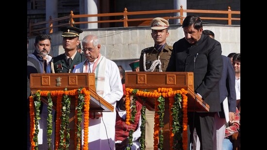 Governor Rajendra Vishvanath Arlekar administers the oath of office to Mukesh Agnihotri on The Ridge in Shimla on Sunday. (Deepak Sansta/HT)