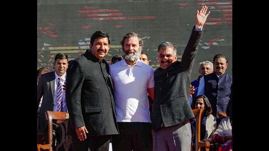 Himachal Pradesh chief minister Sukhwinder Singh Sukhu (R) and his deputy Mukesh Agnihotri (L) with Congress leader Rahul Gandhi after the swearing-in ceremony in Shimla on Sunday. (PTI)