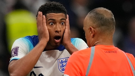 Jude Bellingham reacts in front of referee Wilton Sampaio during the FIFA World Cup quarterfinal against France(AP)